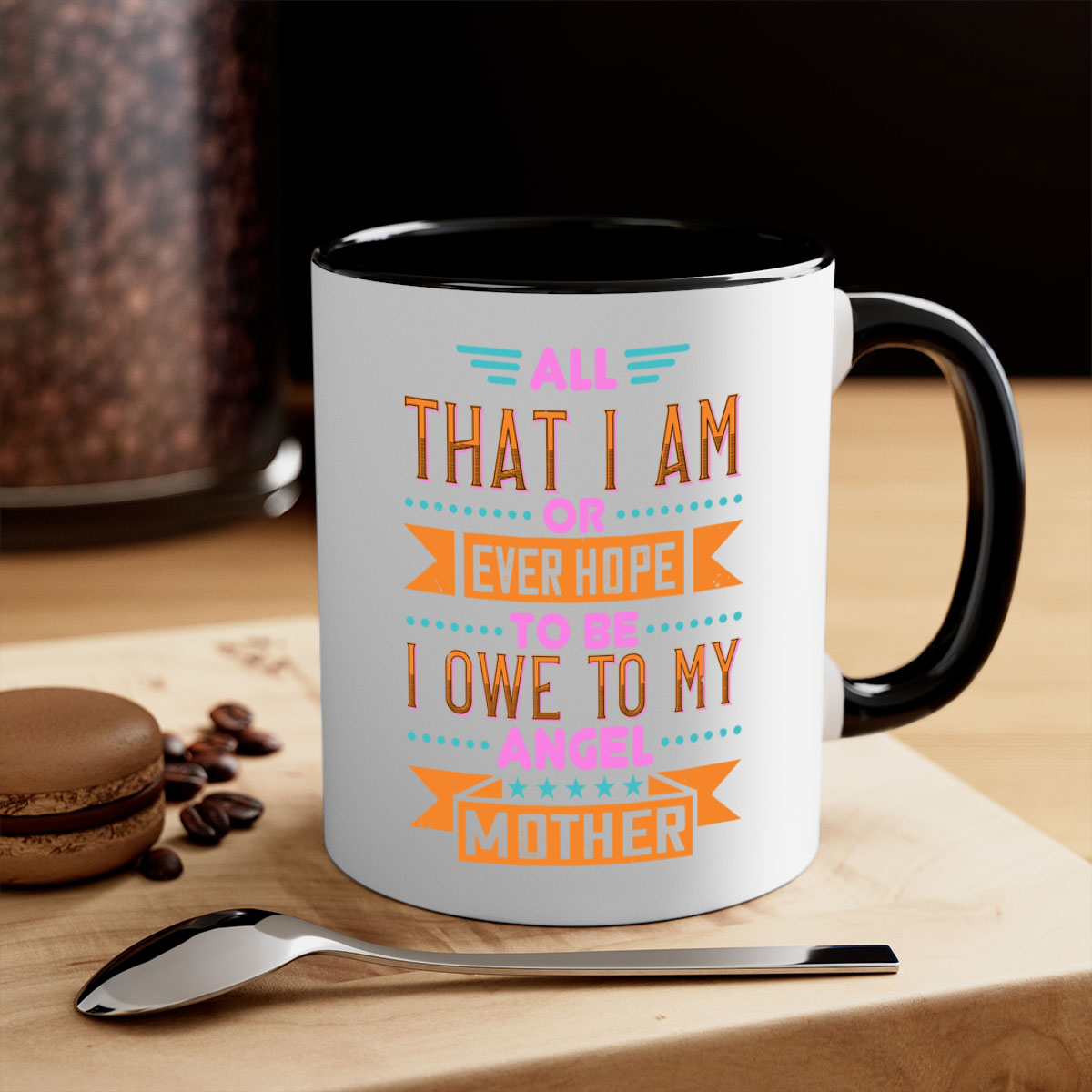 Ceramic mug with a two-tone design featuring a colored handle and interior, showcasing the phrase 'All That I Am or Ever Hope to Be I Owe to My Angel Mother 222#'.