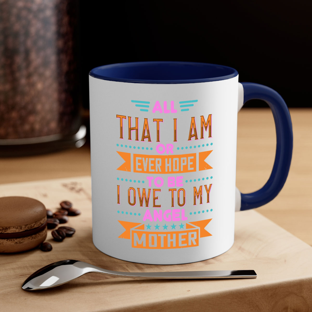 Ceramic mug with a two-tone design featuring a colored handle and interior, showcasing the phrase 'All That I Am or Ever Hope to Be I Owe to My Angel Mother 222#'.