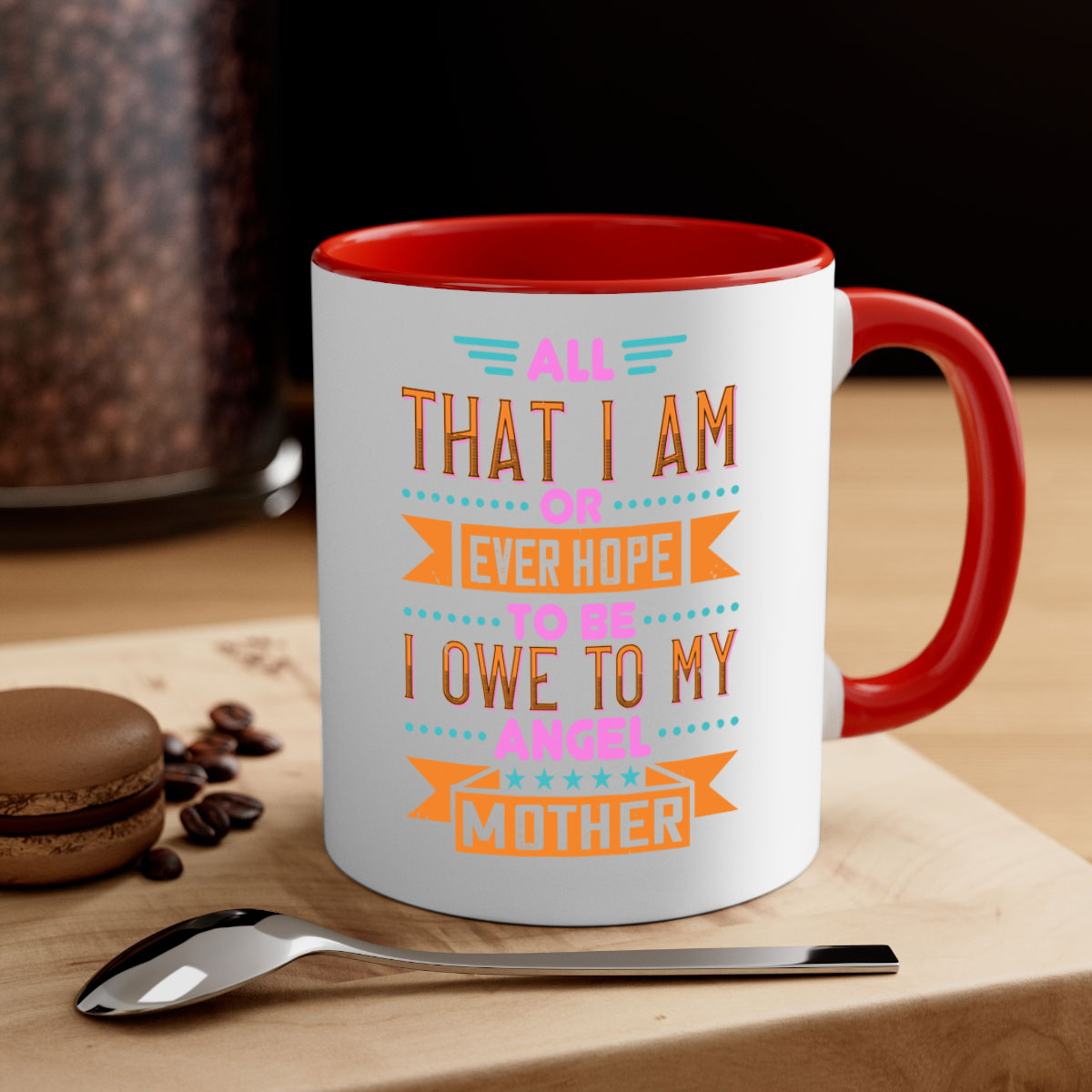 Ceramic mug with a two-tone design featuring a colored handle and interior, showcasing the phrase 'All That I Am or Ever Hope to Be I Owe to My Angel Mother 222#'.