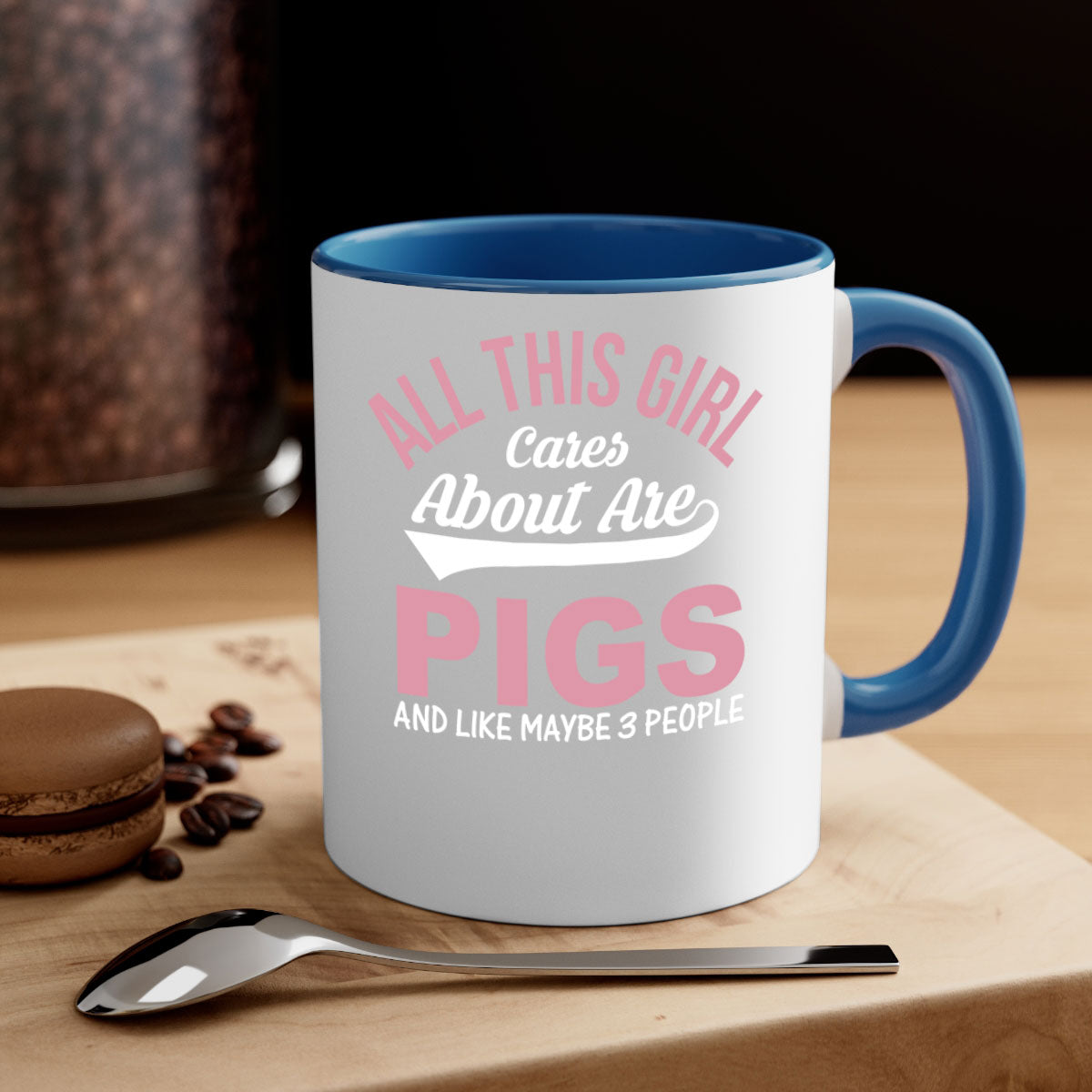 Two-tone ceramic mug with a colorful handle and interior, featuring the phrase 'All This Girl Cares About Are Pigs and Like Maybe People'.
