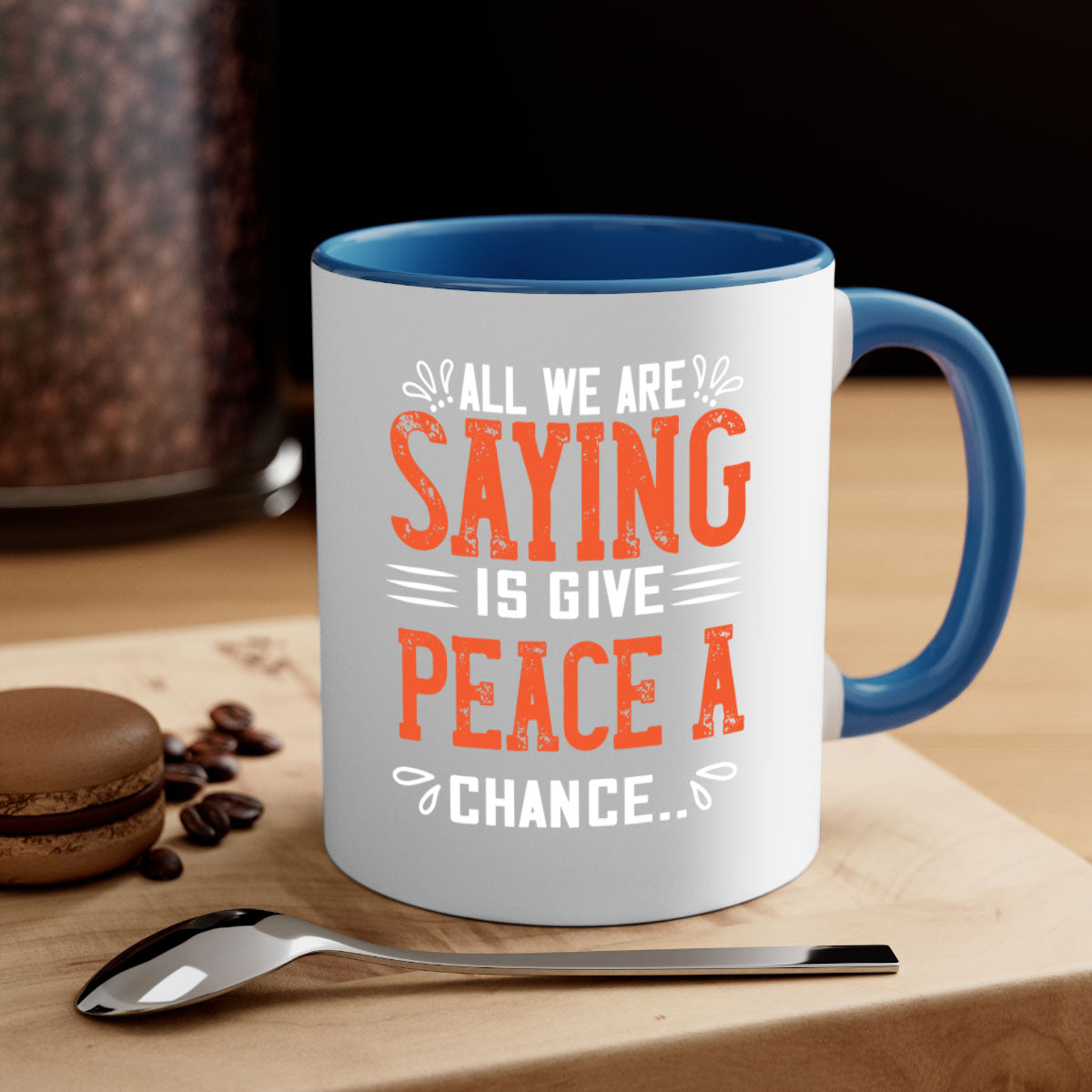All We Are Saying Vegan Mug with colorful handle and glossy finish, available in multiple sizes.