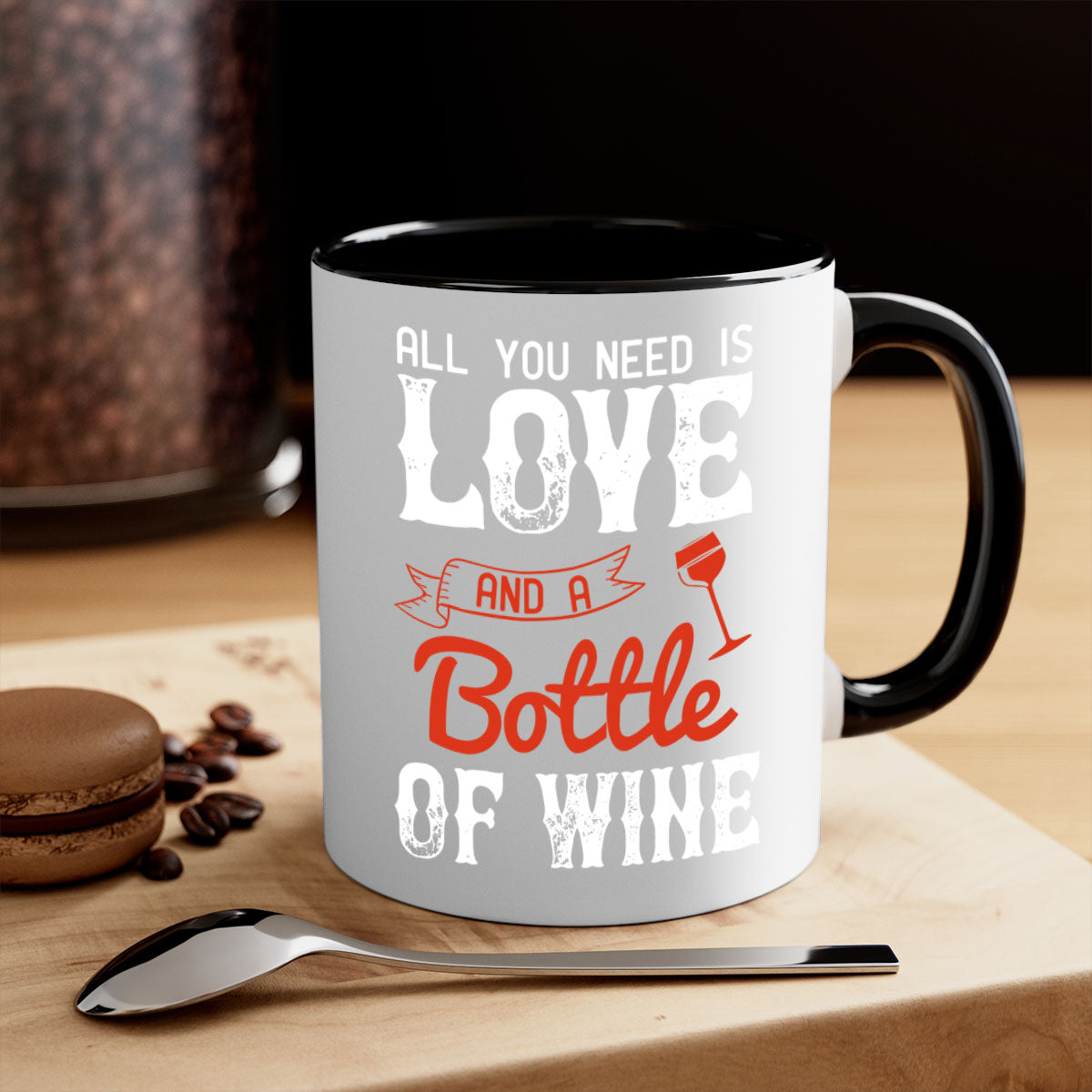 Ceramic mug with colorful handle and interior, featuring the phrase 'All You Need is Love and a Bottle of Wine'.