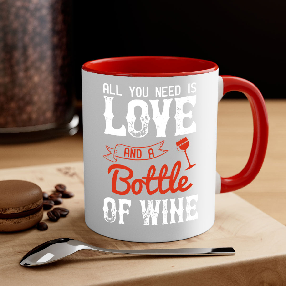 Ceramic mug with colorful handle and interior, featuring the phrase 'All You Need is Love and a Bottle of Wine'.
