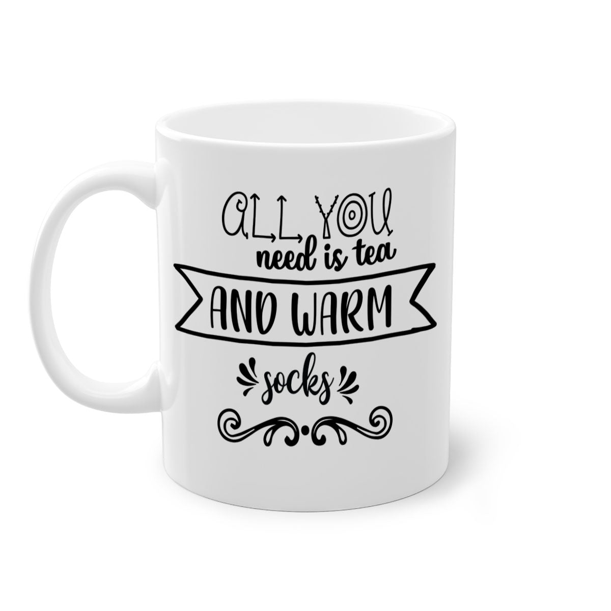 A stylish two-tone ceramic mug with a colored handle and interior, featuring the phrase 'All You Need is Tea and Warm Socks'.