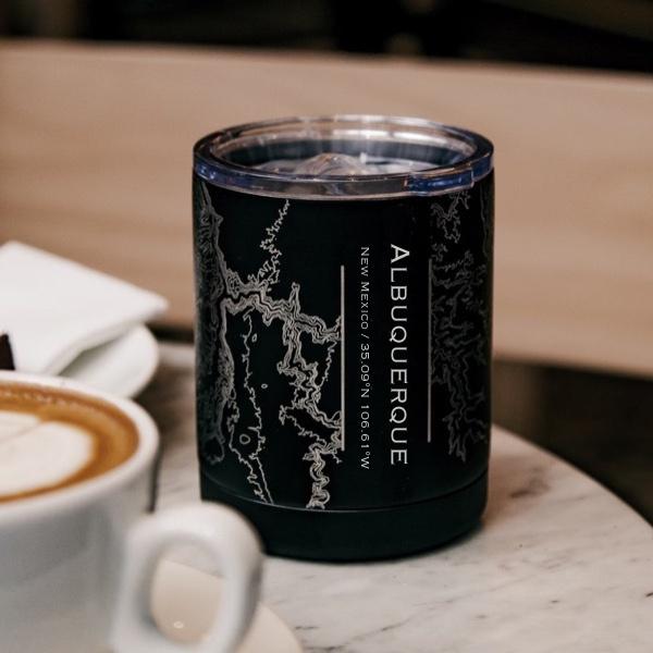 Matte black insulated cup featuring a custom engraved map of Albuquerque, New Mexico with coordinates.