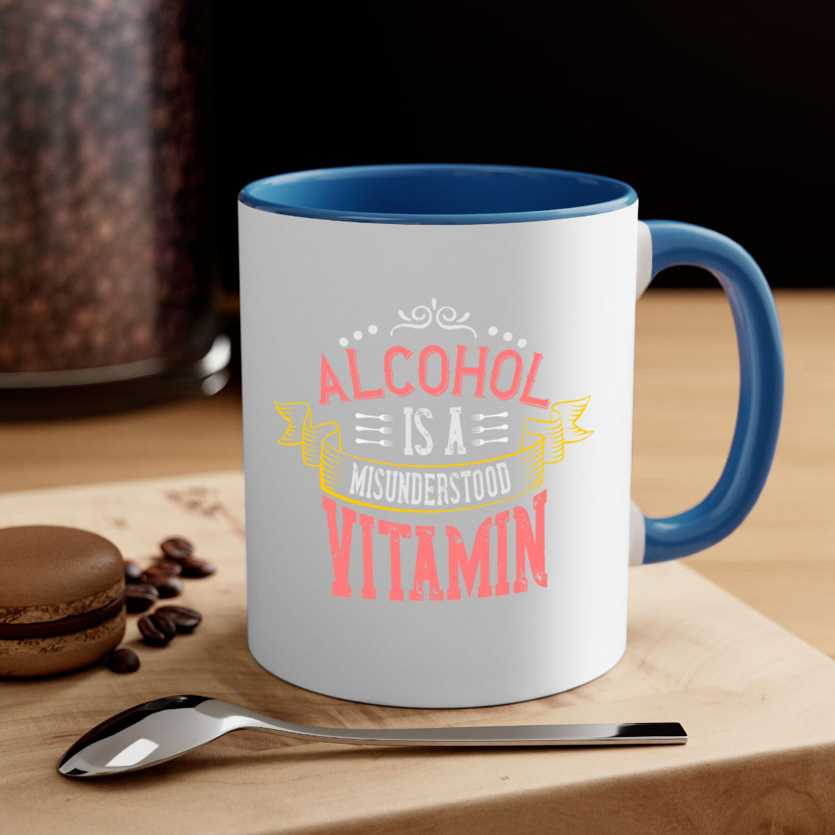 A stylish two-tone coffee mug with a colored handle and glossy finish, featuring the phrase 'Alcohol is a Misunderstood Vitamin'.