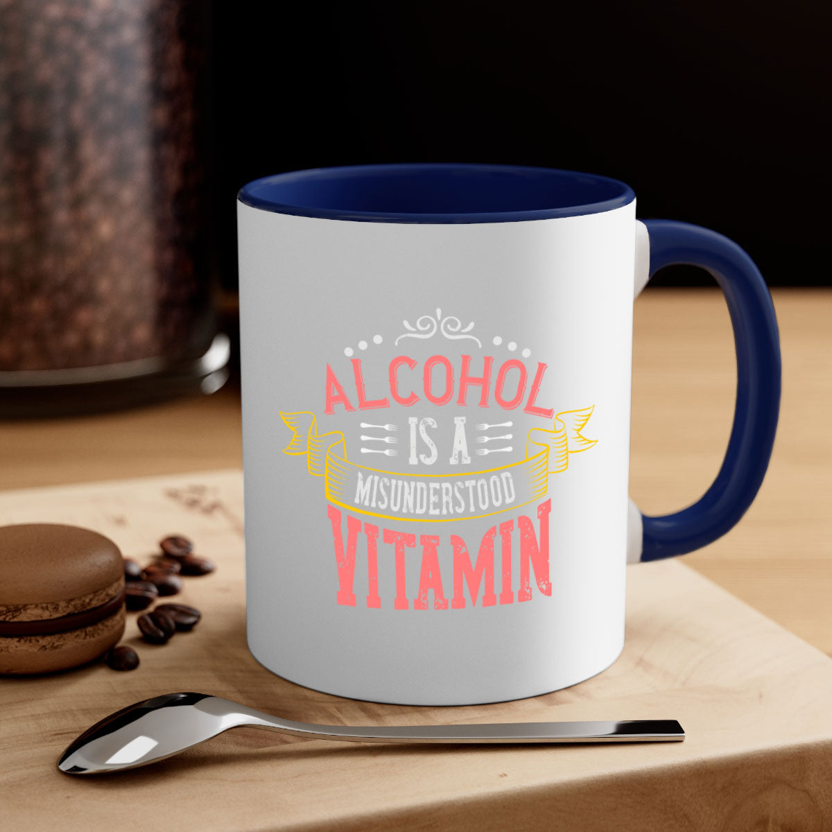 A stylish two-tone coffee mug with a colored handle and glossy finish, featuring the phrase 'Alcohol is a Misunderstood Vitamin'.