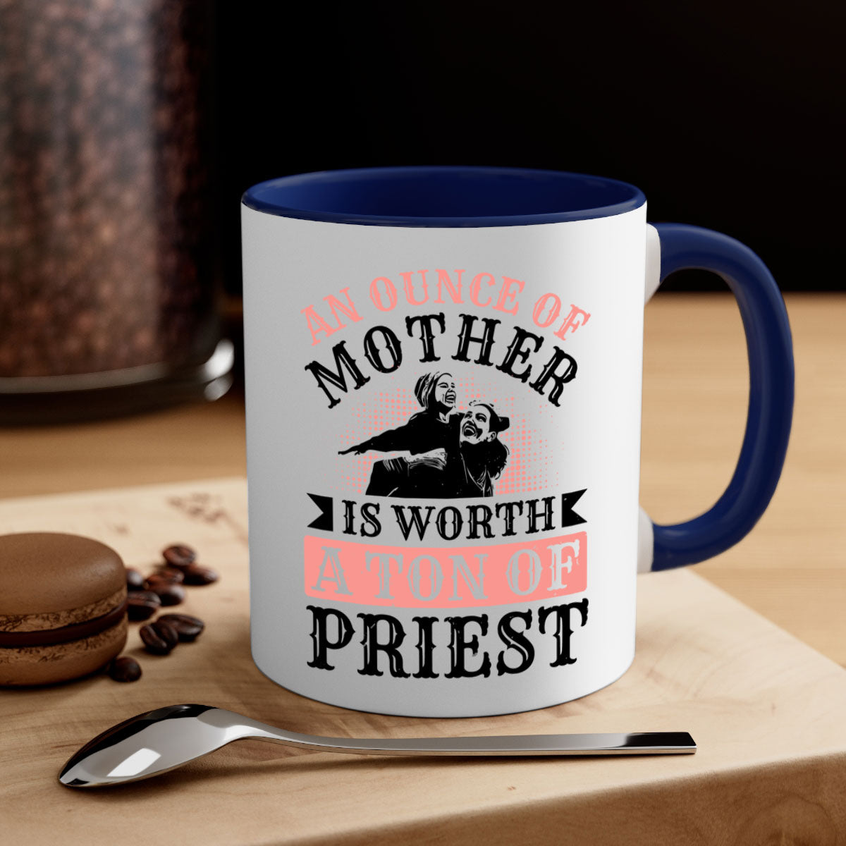 A two-tone ceramic mug with a colored handle and glossy finish, featuring the quote 'An Ounce of Mother is Worth a Ton of Priest'.
