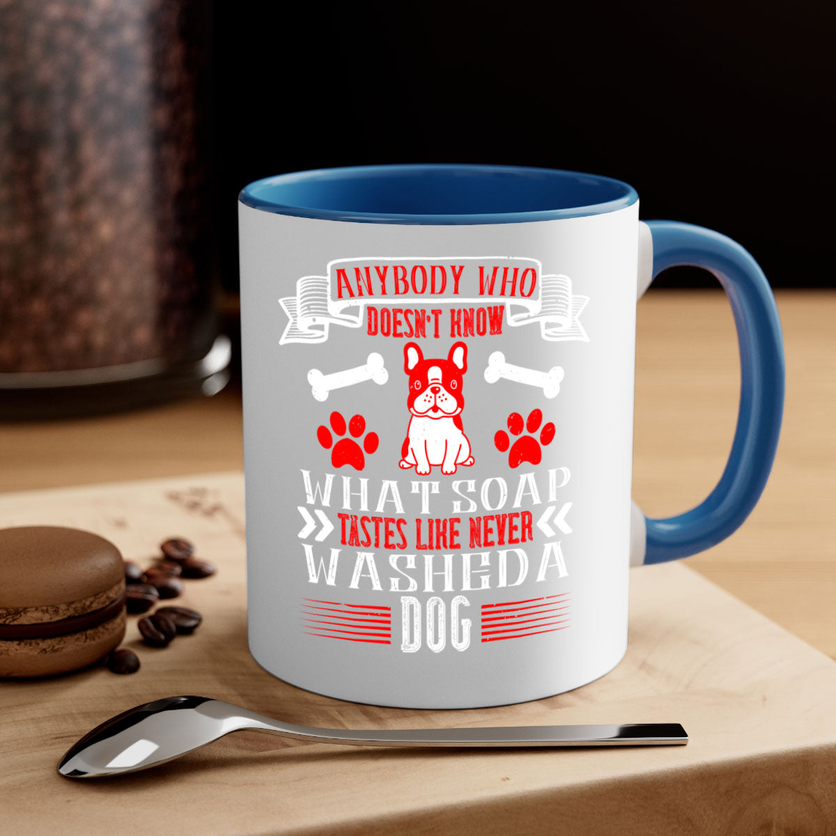 A two-tone ceramic mug featuring the quote 'Anybody who doesn’t know what soap tastes like never washed a dog', with a glossy finish and colored handle.