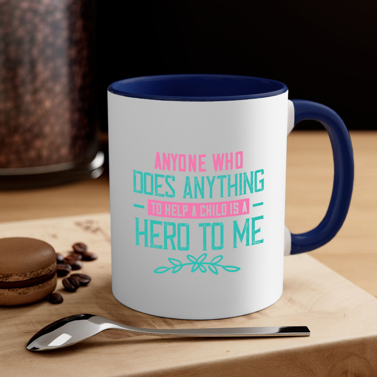 A two-tone ceramic mug featuring the quote 'Anyone who does anything to help a child is a hero to me', available in multiple colors.