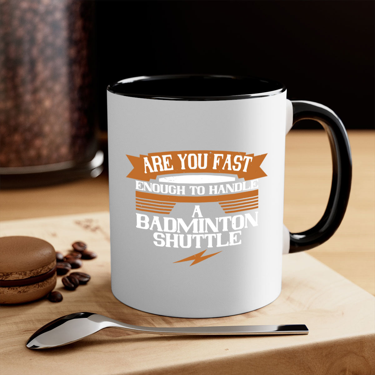 A stylish two-tone ceramic mug featuring a badminton shuttle design, available in multiple colors with a glossy finish and easy-grip handle.