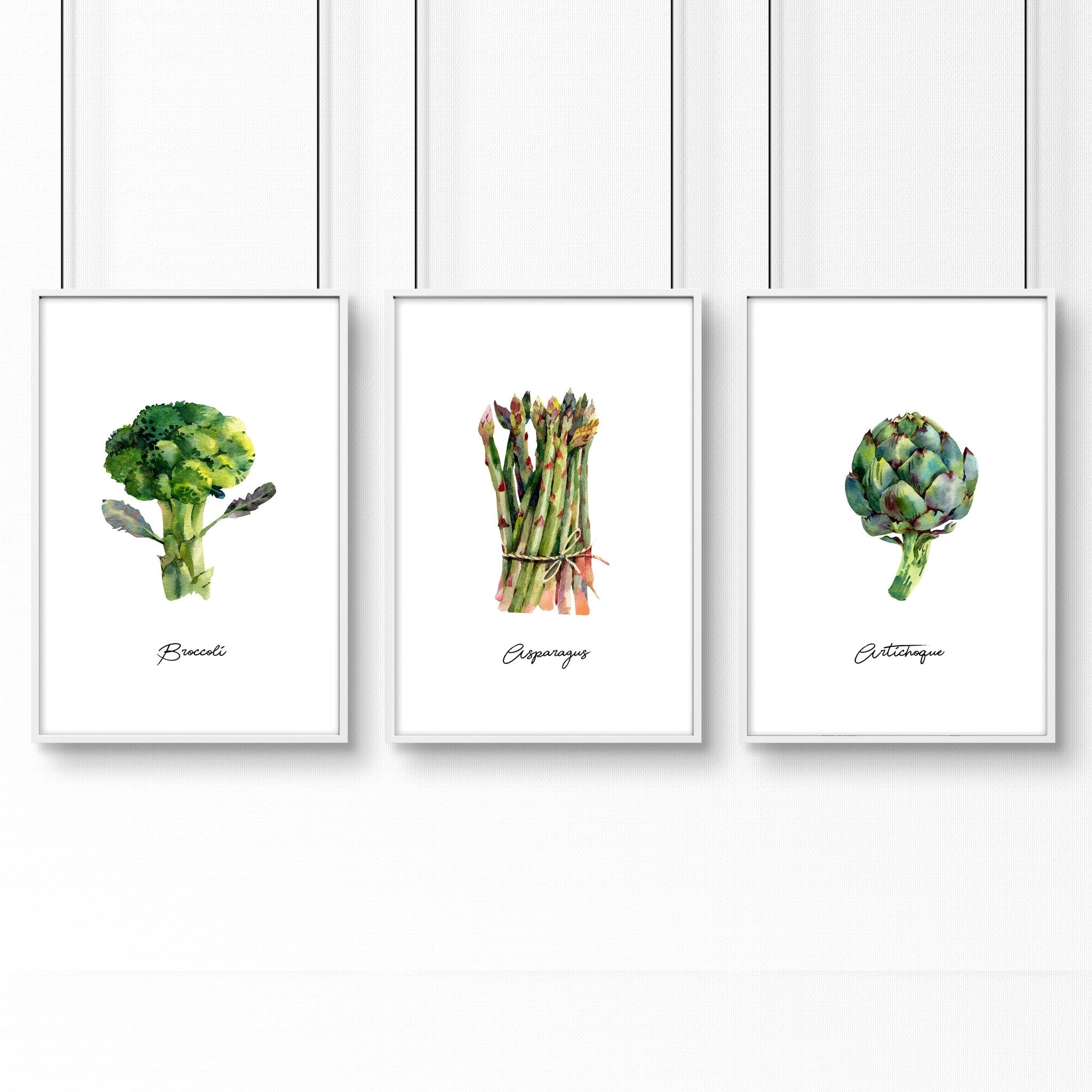 Set of 3 framed vegetable wall art prints featuring vibrant illustrations of fresh vegetables, perfect for kitchen decor.