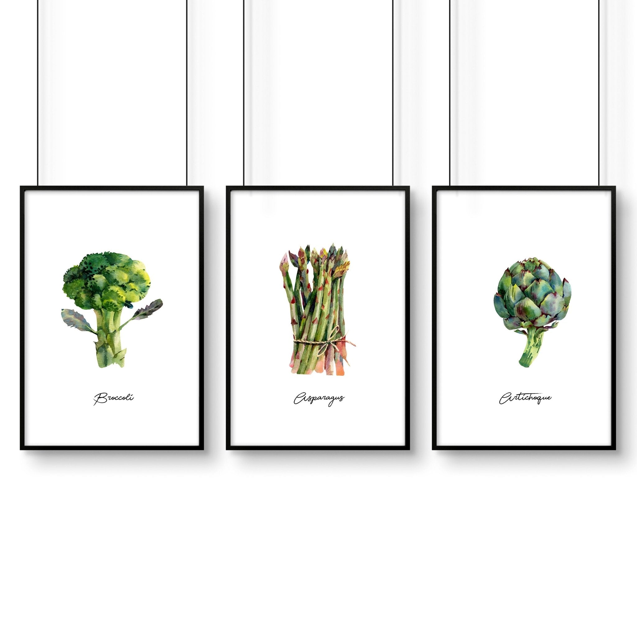 Set of 3 framed vegetable wall art prints featuring vibrant illustrations of fresh vegetables, perfect for kitchen decor.