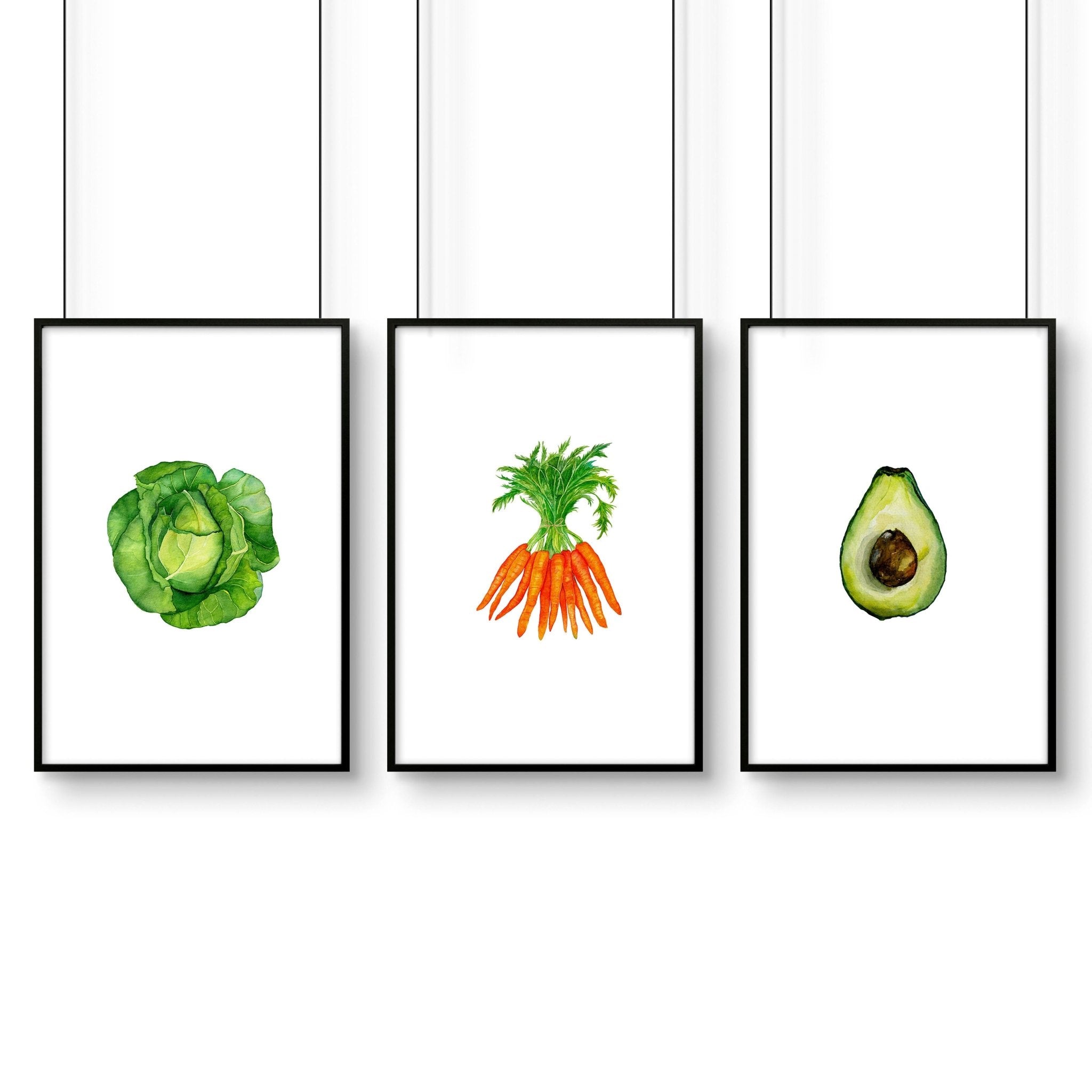 Set of 3 framed vegetable prints showcasing vibrant illustrations of vegetables, perfect for kitchen decor.