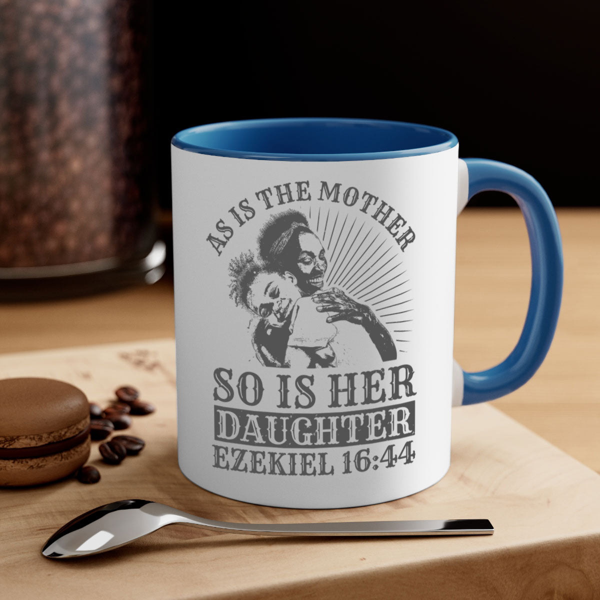 Two-tone ceramic mug with colored handle and interior, featuring the phrase 'As Is the Mother So Is Her Daughter' in elegant font.
