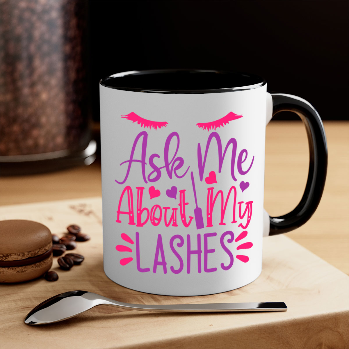 A stylish two-tone coffee mug with a colored handle and glossy finish, featuring the phrase 'Ask Me About My Lashes' in a chic design.