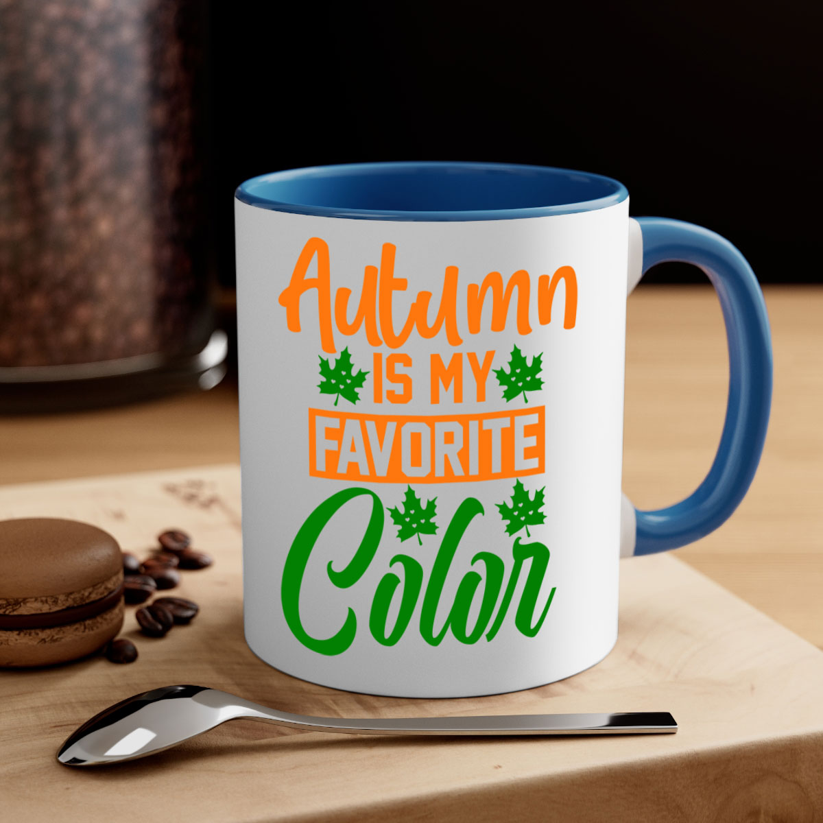 A two-tone ceramic mug with a glossy finish, featuring a colored handle and interior, perfect for enjoying autumn beverages.