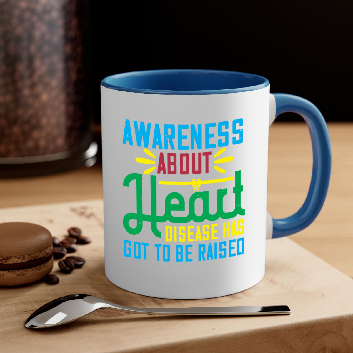 Two-tone ceramic mug with colored handle and glossy finish, promoting heart disease awareness.