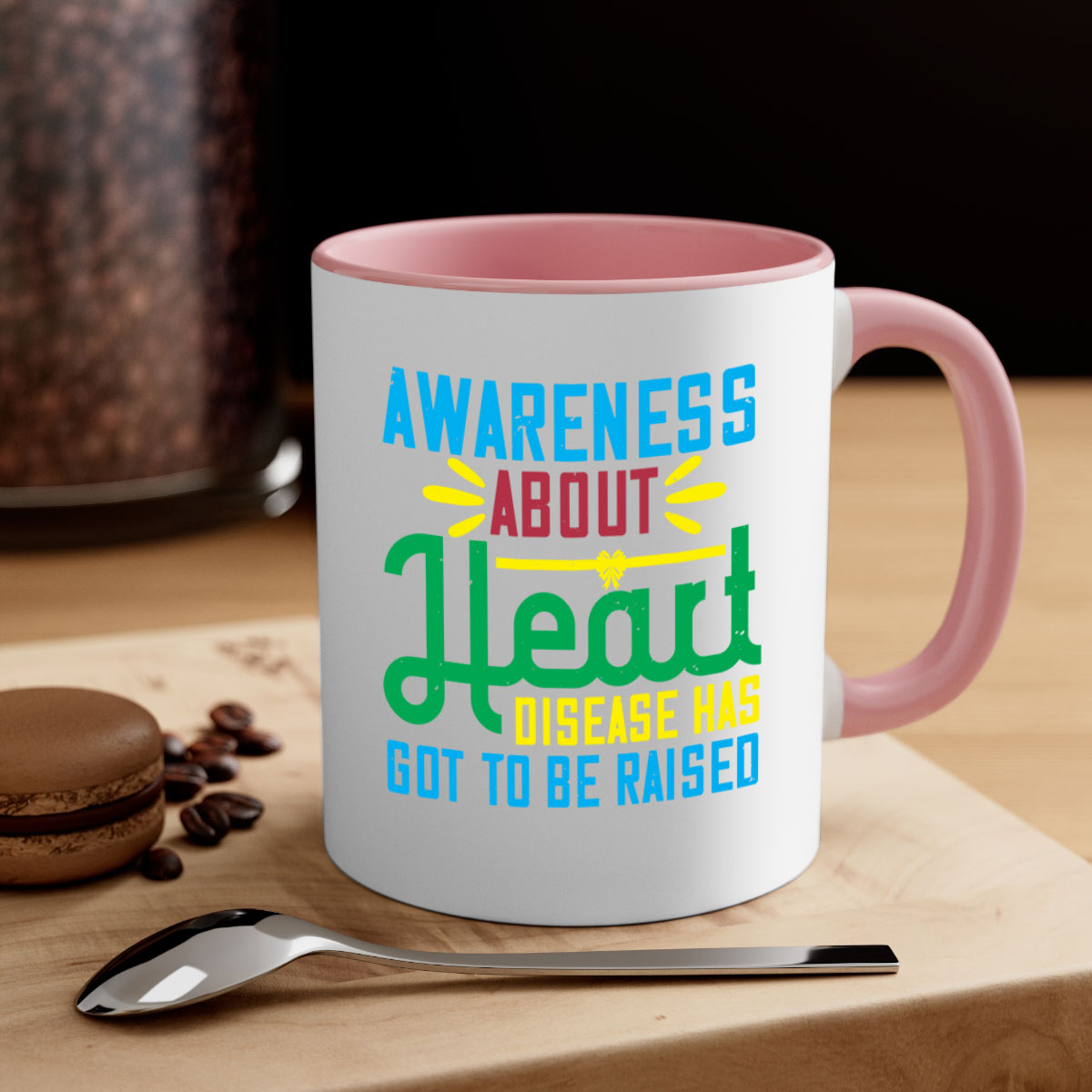 Two-tone ceramic mug with colored handle and glossy finish, promoting heart disease awareness.