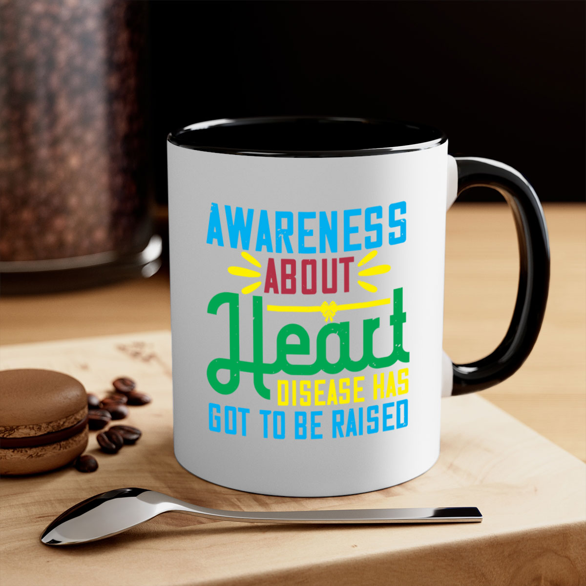 Two-tone ceramic mug with colored handle and glossy finish, promoting heart disease awareness.