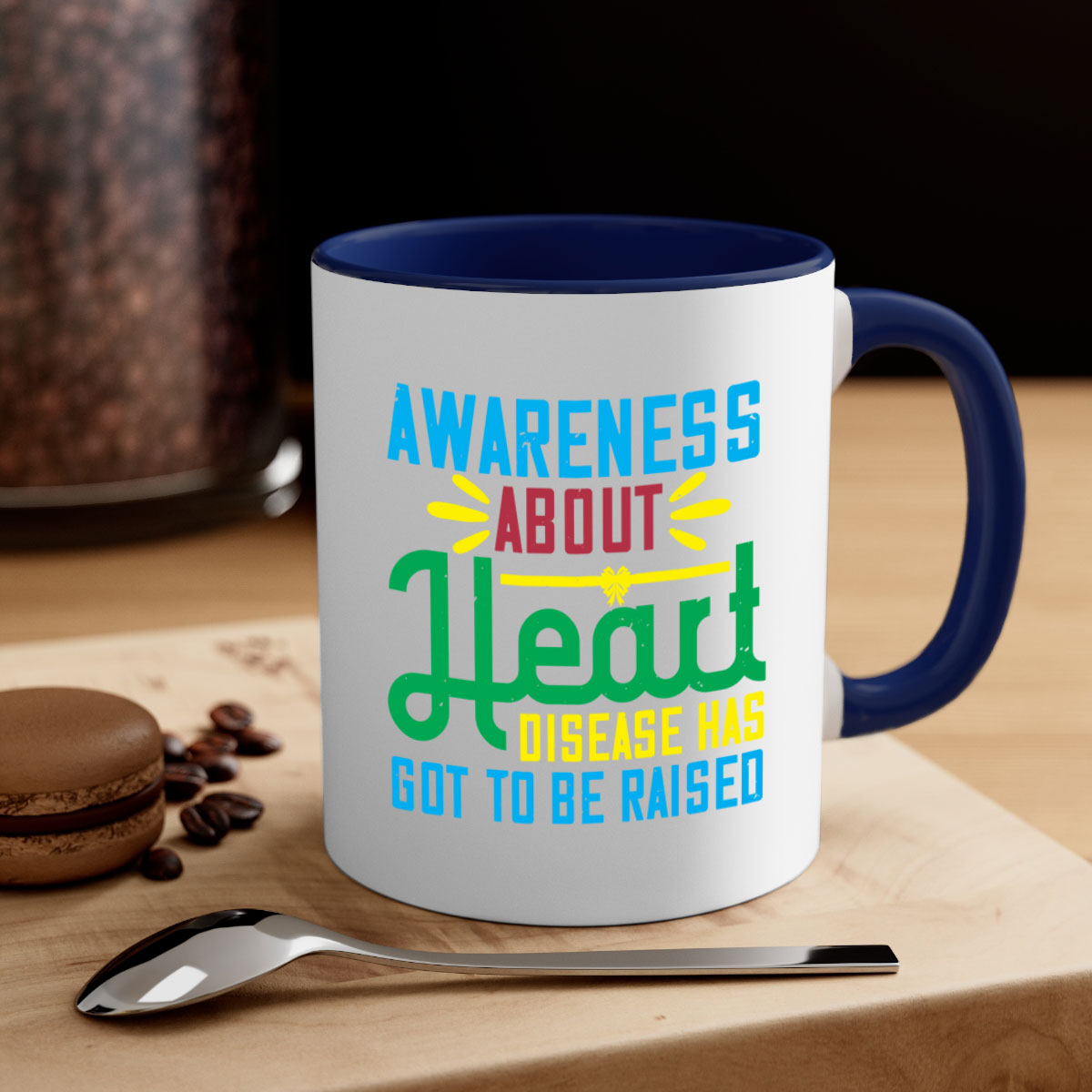 Two-tone ceramic mug with colored handle and glossy finish, promoting heart disease awareness.