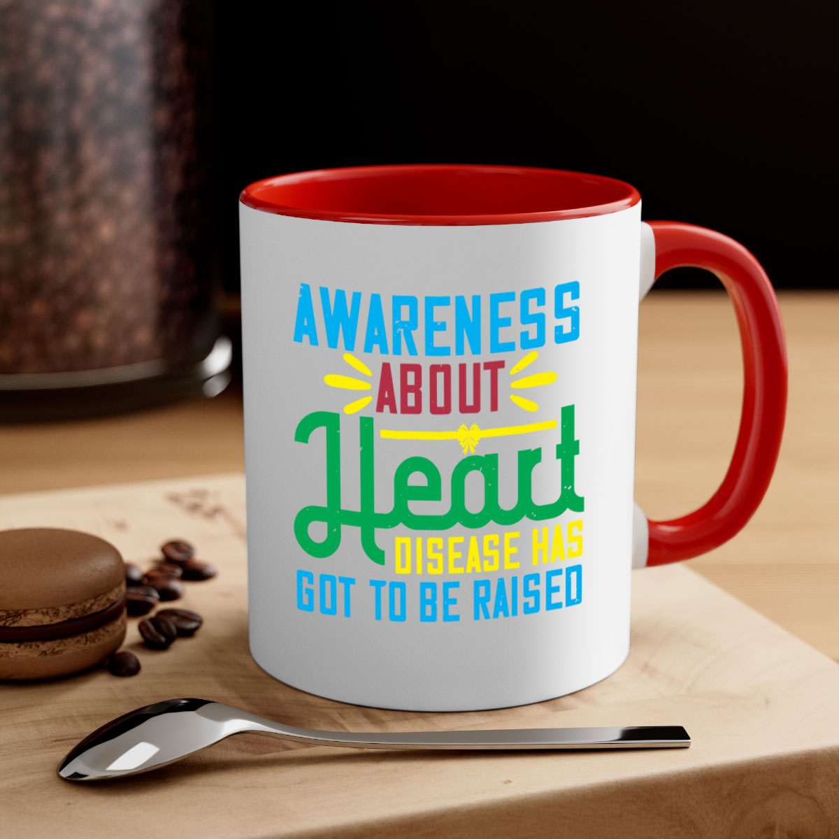 Two-tone ceramic mug with colored handle and glossy finish, promoting heart disease awareness.