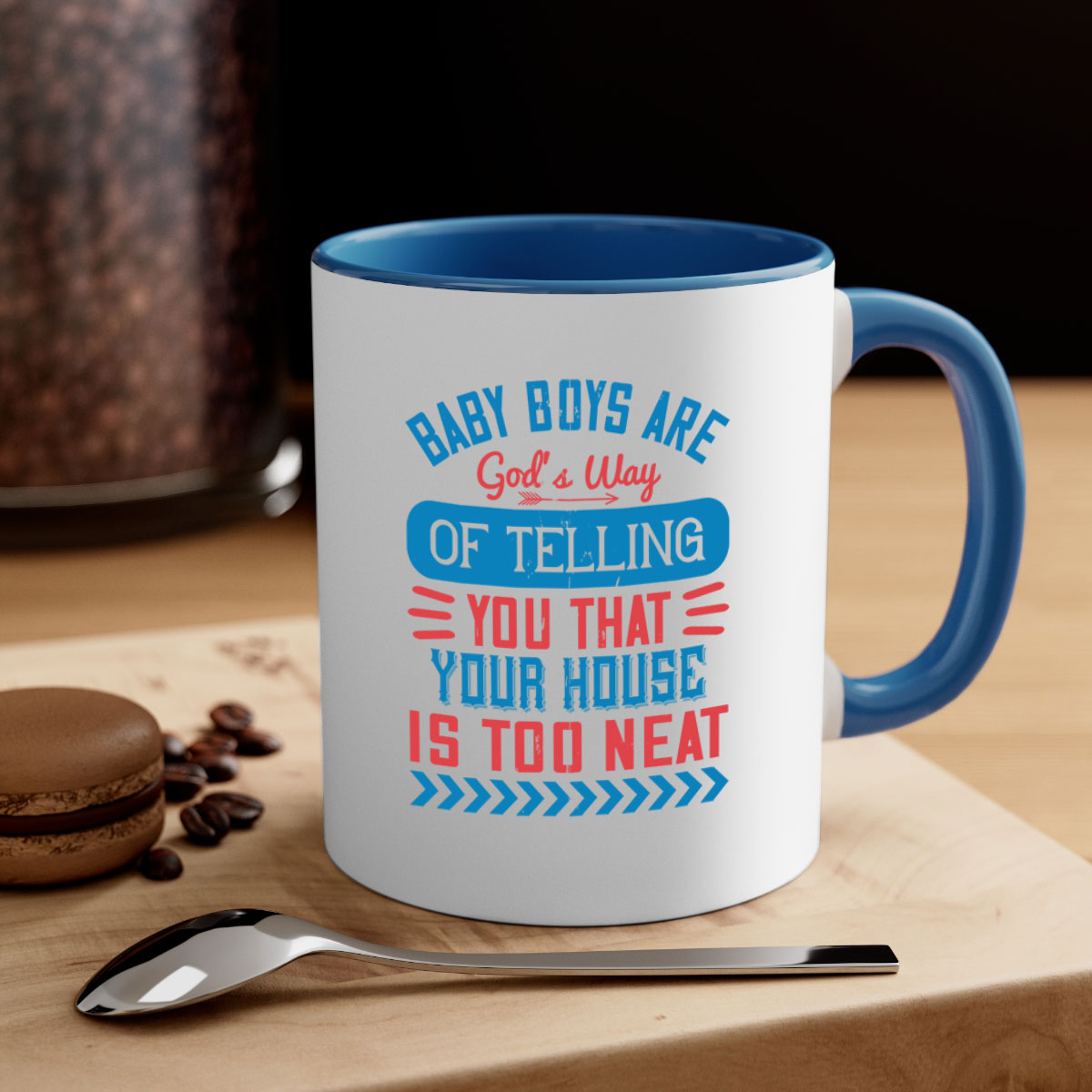 A two-tone ceramic mug with a humorous quote about baby boys, featuring a glossy finish and a colored handle.