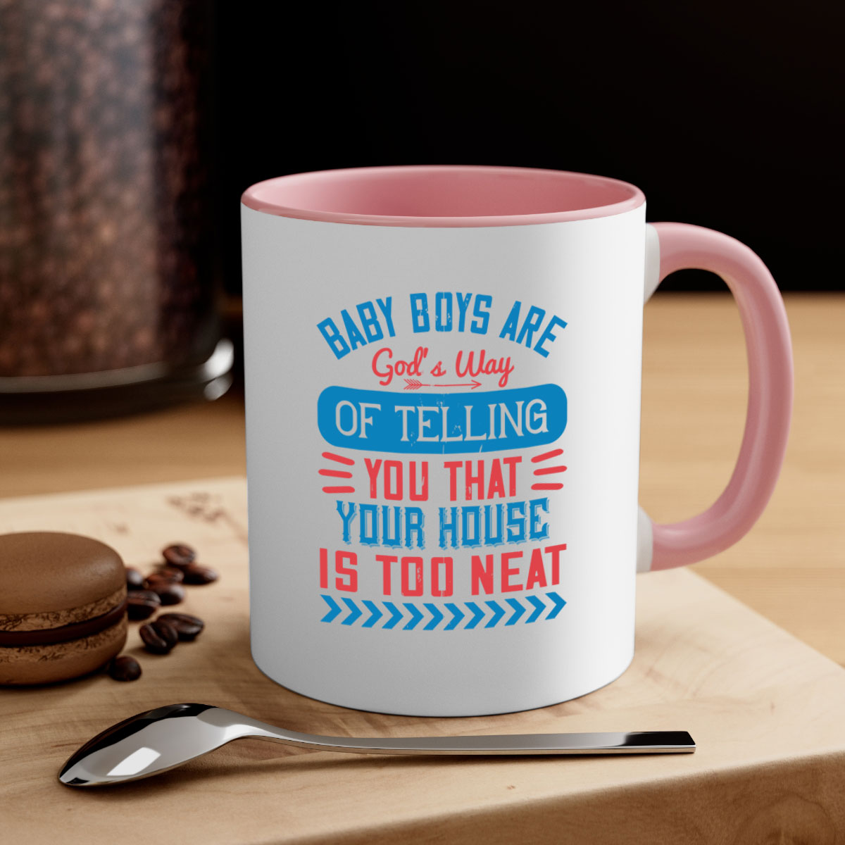 A two-tone ceramic mug with a humorous quote about baby boys, featuring a glossy finish and a colored handle.