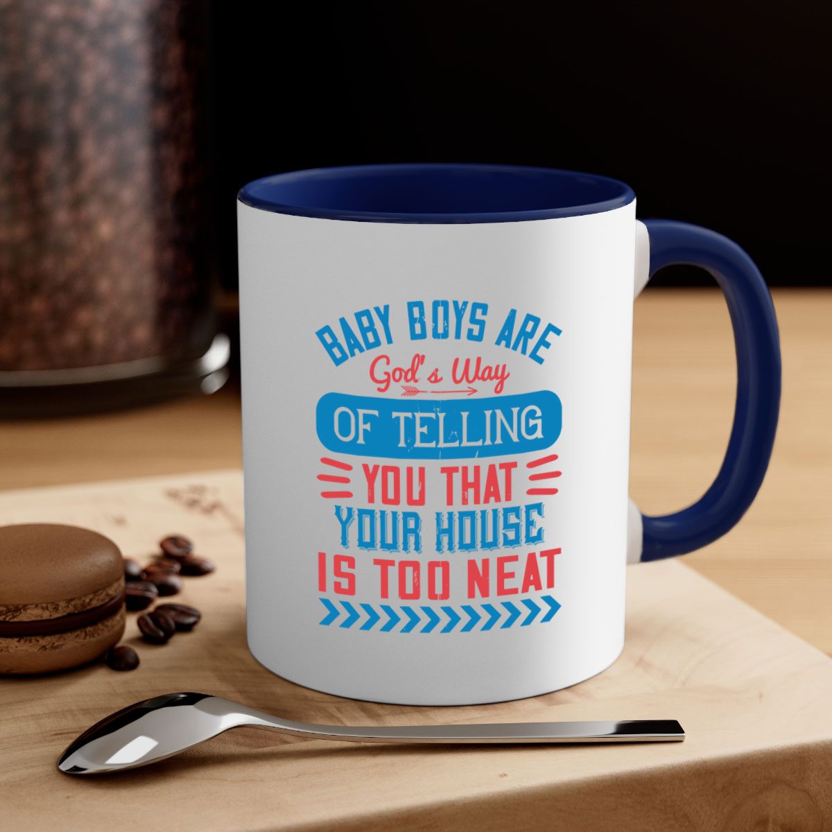 A two-tone ceramic mug with a humorous quote about baby boys, featuring a glossy finish and a colored handle.