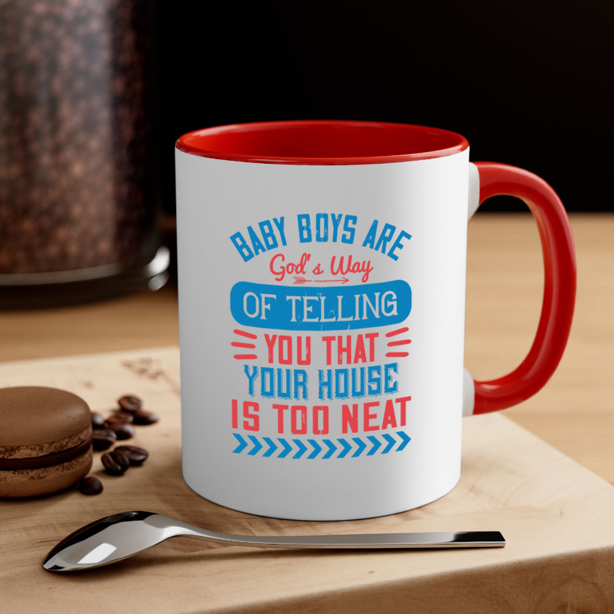 A two-tone ceramic mug with a humorous quote about baby boys, featuring a glossy finish and a colored handle.