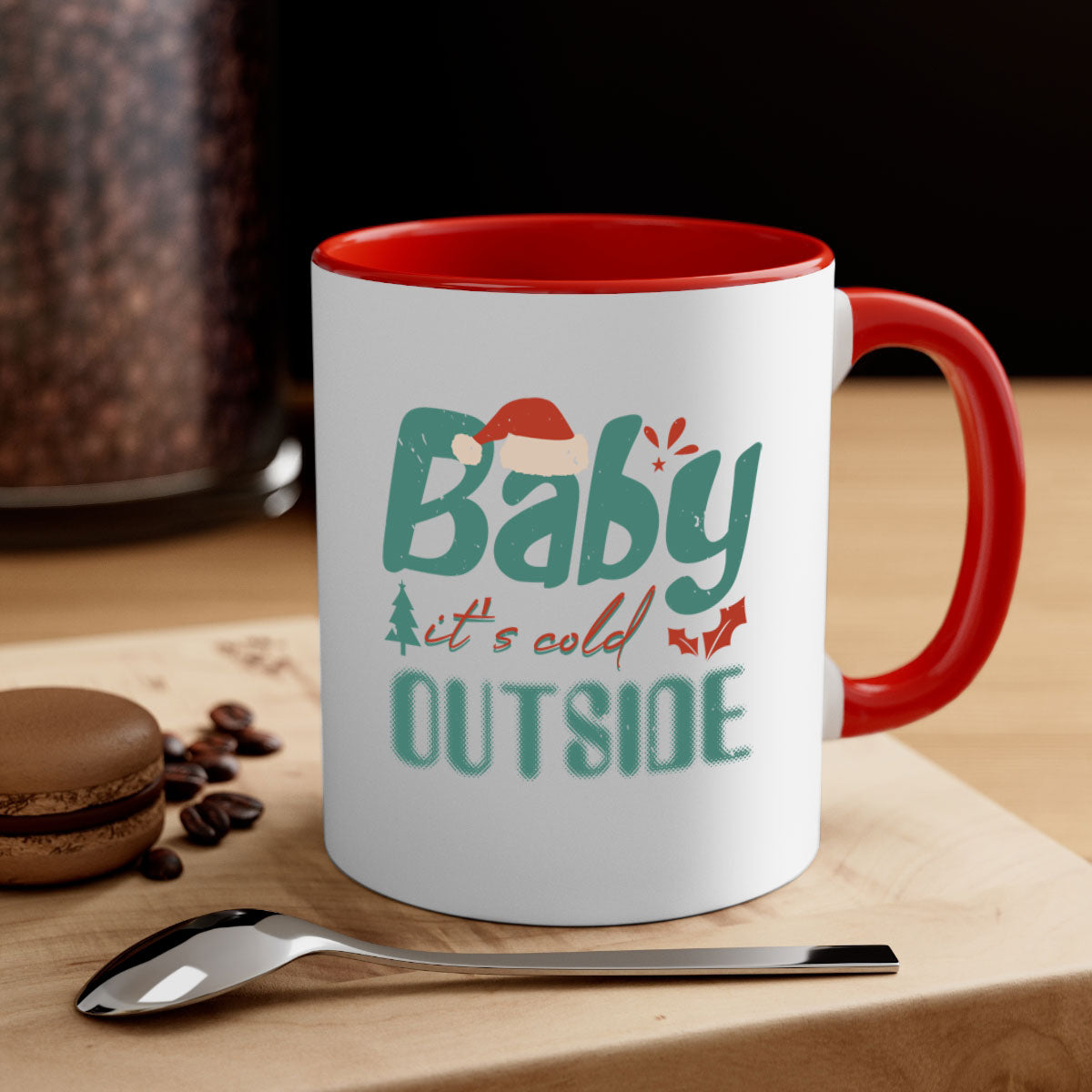 A stylish two-tone ceramic mug with the phrase 'Baby It's Cold Outside' printed on it, featuring a colored handle and glossy finish.