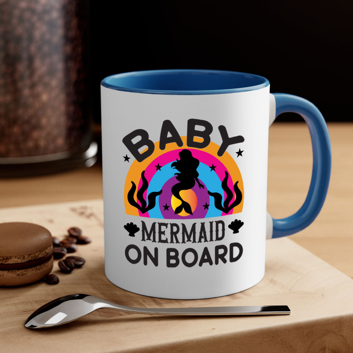 A colorful Baby Mermaid on Board Mug featuring a glossy finish and a C-shaped handle, available in multiple colors.