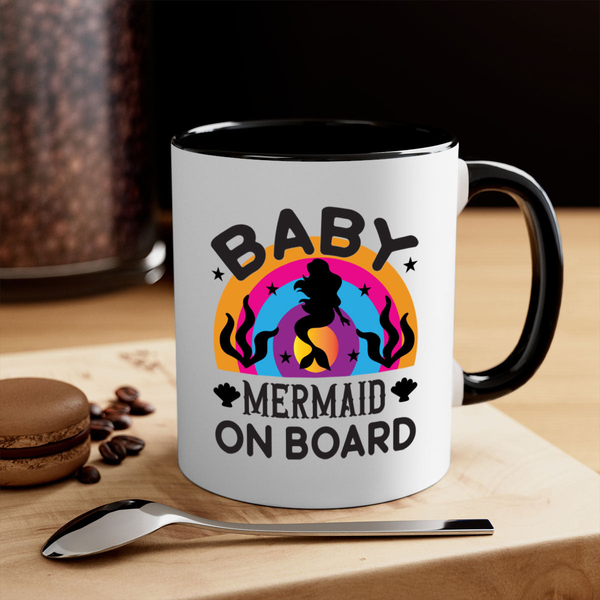 A colorful Baby Mermaid on Board Mug featuring a glossy finish and a C-shaped handle, available in multiple colors.