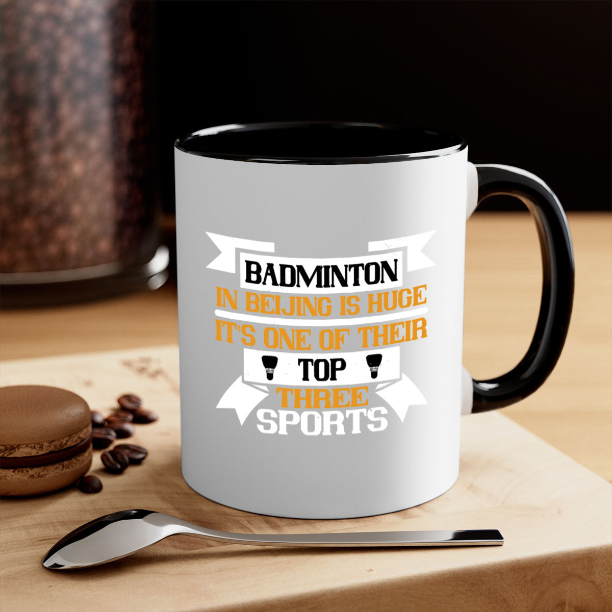 A stylish two-tone ceramic mug featuring a colored handle and glossy finish, perfect for badminton enthusiasts.