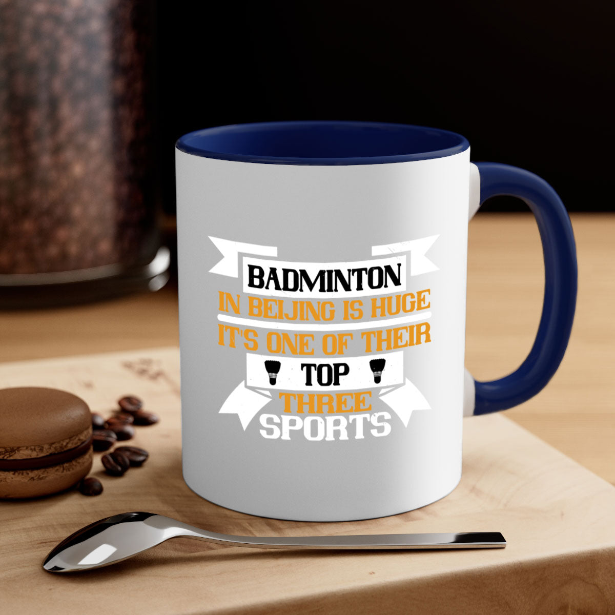 A stylish two-tone ceramic mug featuring a colored handle and glossy finish, perfect for badminton enthusiasts.