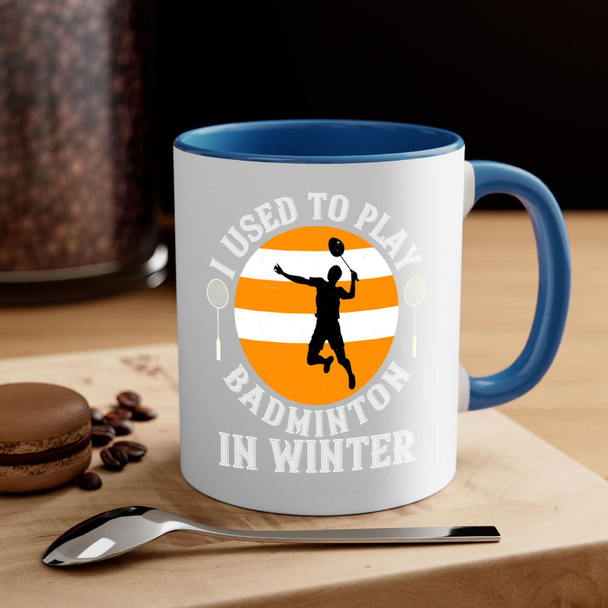 A stylish two-tone badminton-themed coffee mug with a colored handle and glossy finish, available in multiple colors.