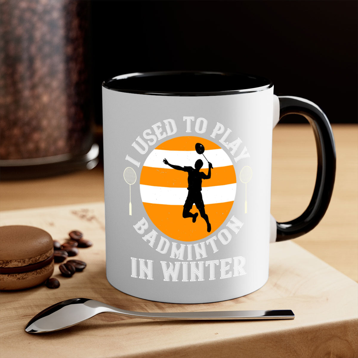A stylish two-tone badminton-themed coffee mug with a colored handle and glossy finish, available in multiple colors.