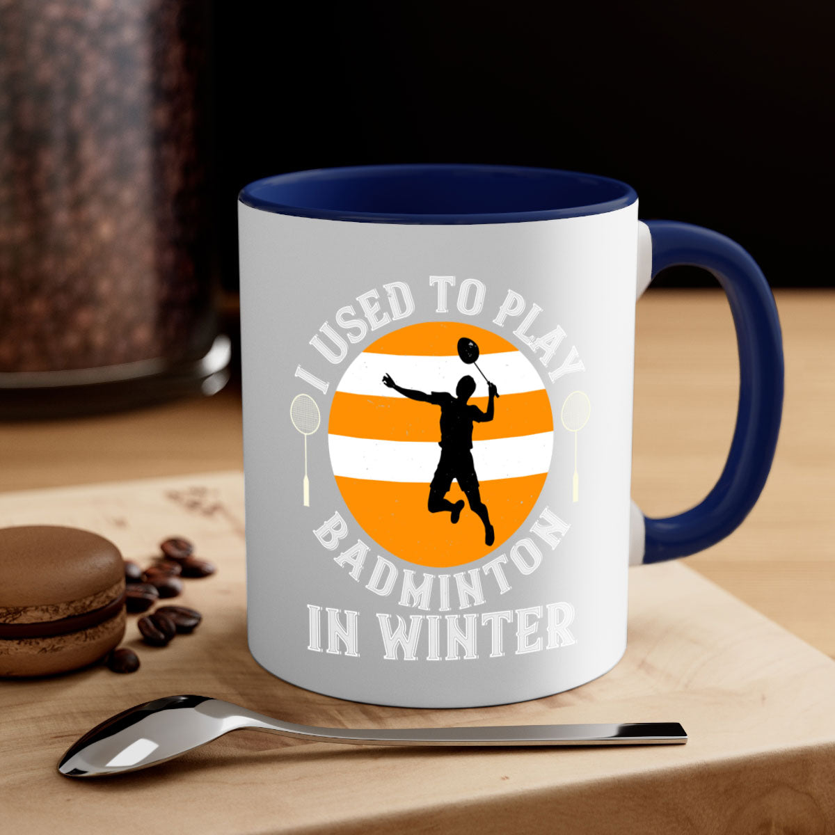A stylish two-tone badminton-themed coffee mug with a colored handle and glossy finish, available in multiple colors.