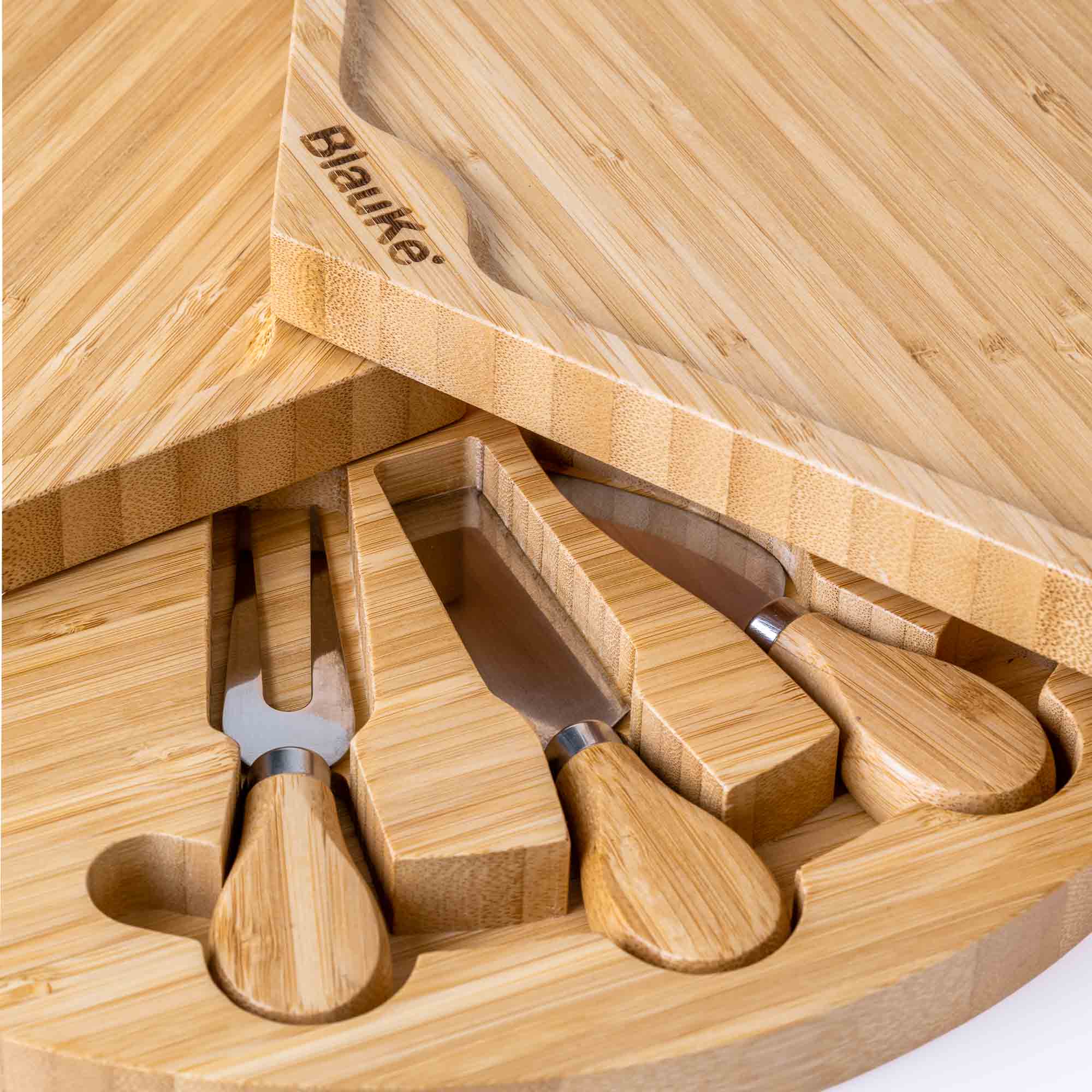 A stylish 14-inch bamboo cheese board with a knife set, featuring a smooth surface and hidden drawer for cheese tools, perfect for charcuterie presentations.