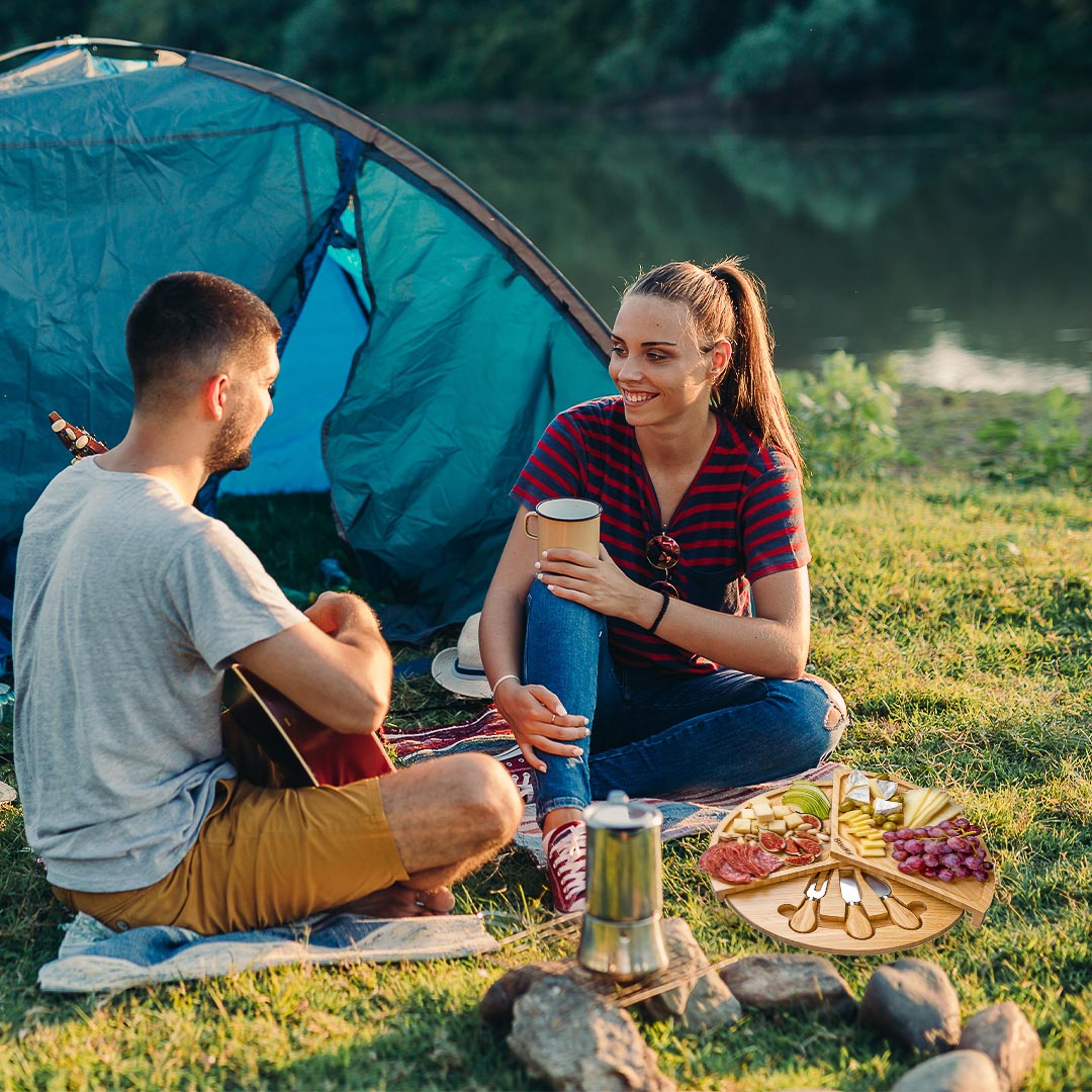 A stylish 14-inch bamboo cheese board with a knife set, featuring a smooth surface and hidden drawer for cheese tools, perfect for charcuterie presentations.