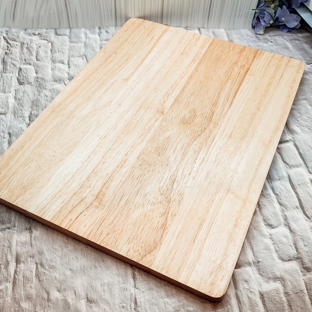 Bamboo Conversions 12.75x10" kitchen decor and cutting board, showcasing its dual functionality and natural bamboo finish.