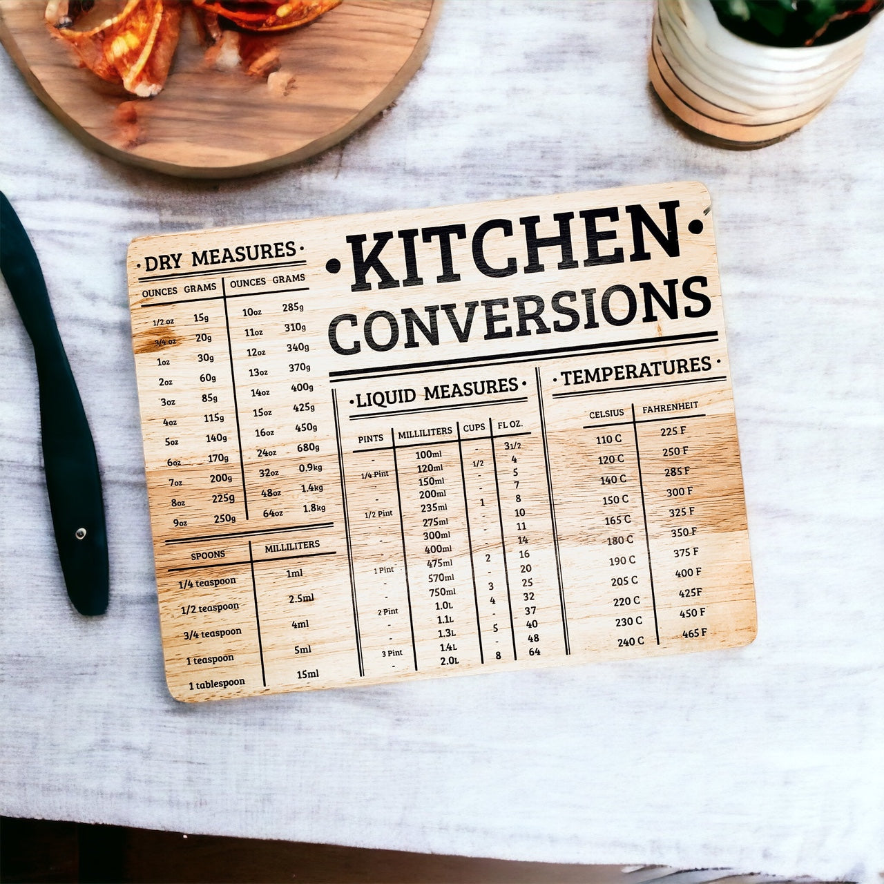 Bamboo Conversions 12.75x10" kitchen decor and cutting board, showcasing its dual functionality and natural bamboo finish.