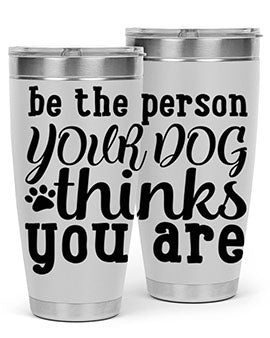20oz stainless steel tumbler with a printed design saying 'Be the Person Your Dog Thinks You Are', featuring a drink-thru lid.