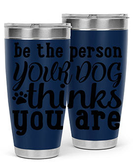 20oz stainless steel tumbler with a printed design saying 'Be the Person Your Dog Thinks You Are', featuring a drink-thru lid.
