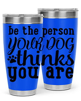 20oz stainless steel tumbler with a printed design saying 'Be the Person Your Dog Thinks You Are', featuring a drink-thru lid.