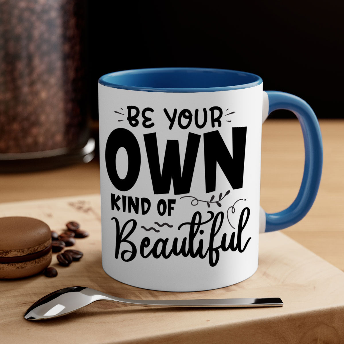 A stylish two-tone ceramic coffee mug with a glossy finish, featuring the phrase 'Be Your Own Kind of Beautiful' and a comfortable C-shaped handle.