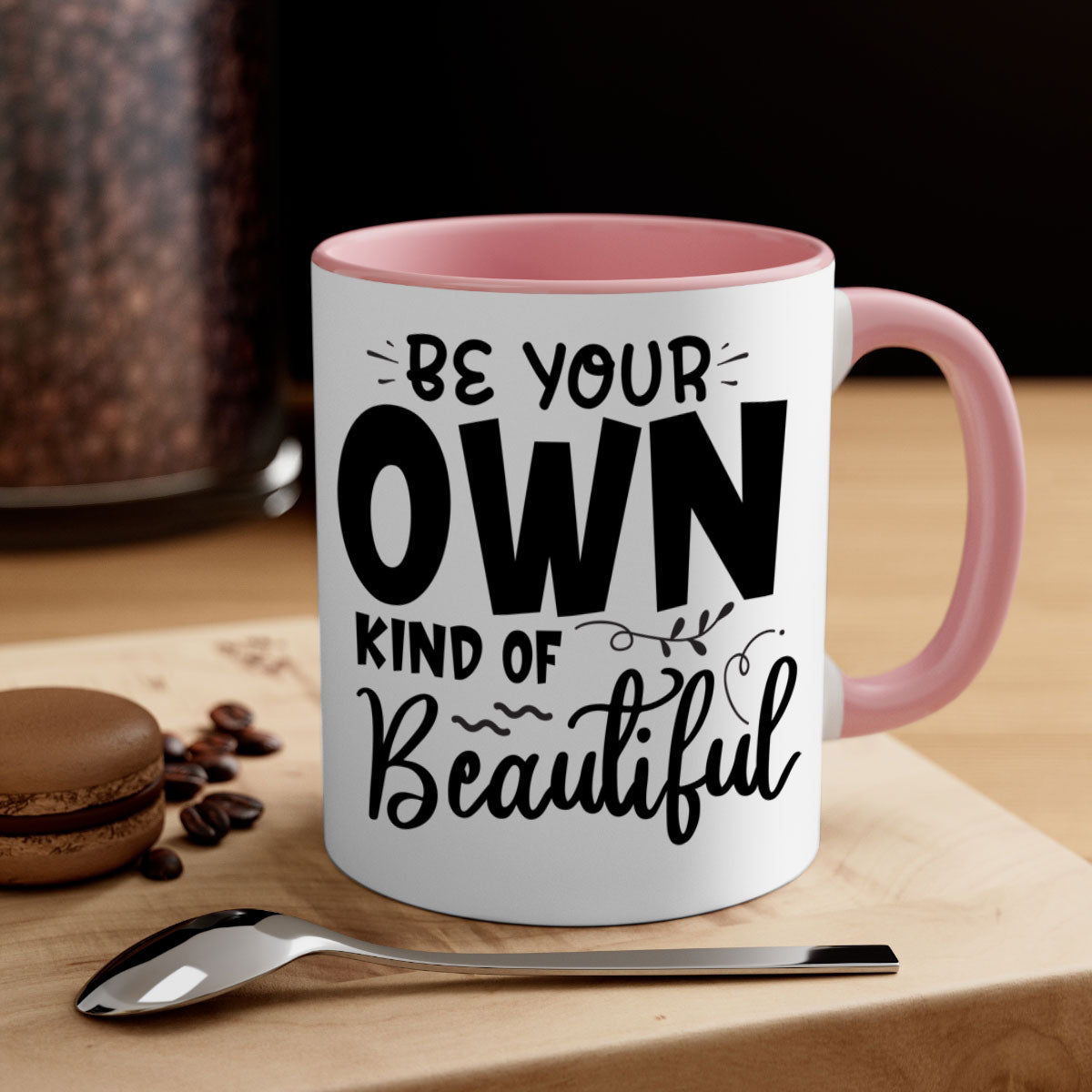 A stylish two-tone ceramic coffee mug with a glossy finish, featuring the phrase 'Be Your Own Kind of Beautiful' and a comfortable C-shaped handle.