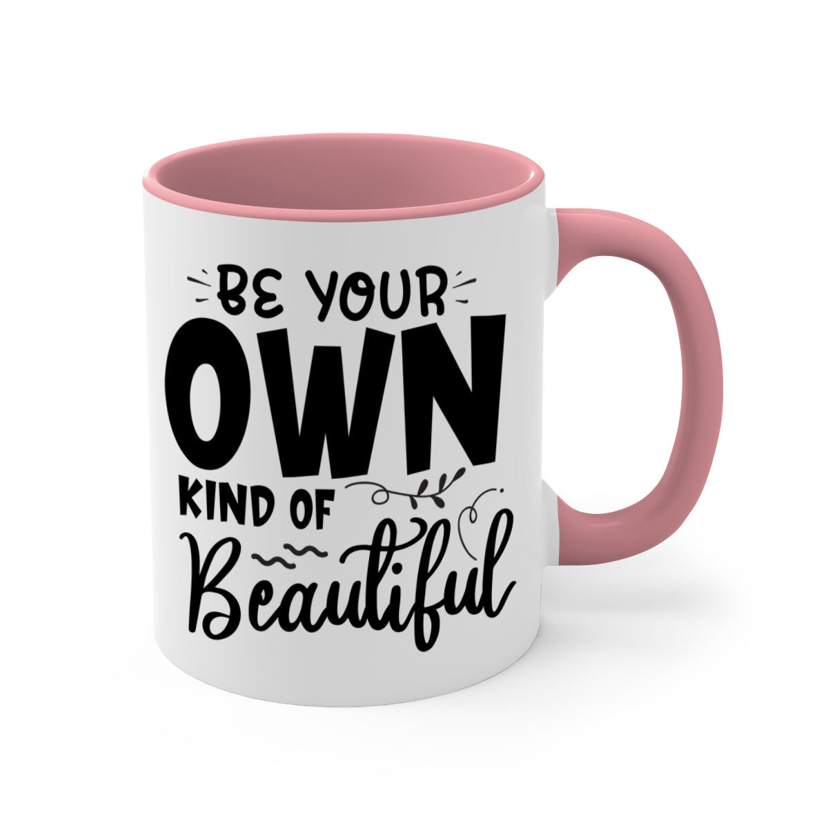 A stylish two-tone ceramic coffee mug with a glossy finish, featuring the phrase 'Be Your Own Kind of Beautiful' and a comfortable C-shaped handle.