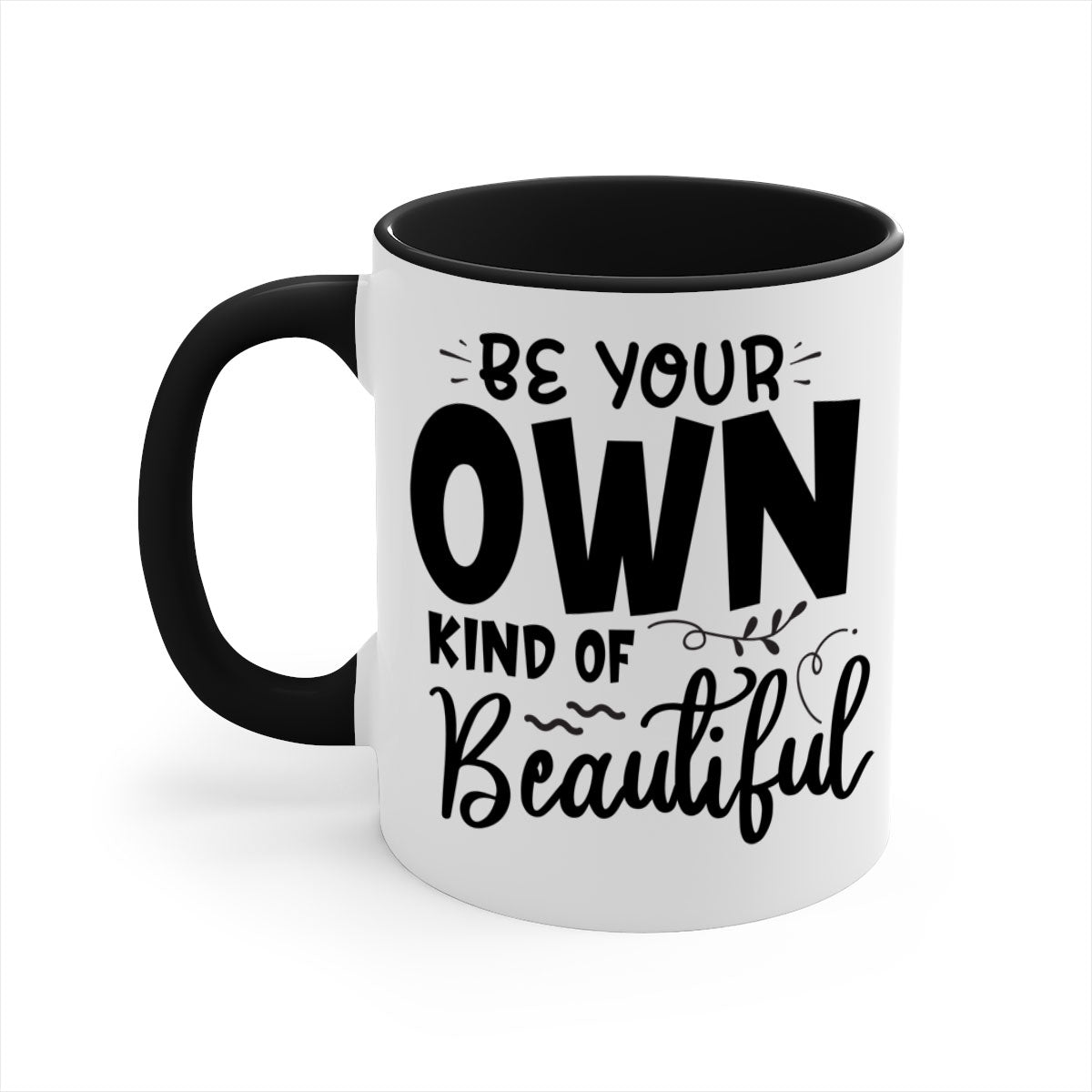 A stylish two-tone ceramic coffee mug with a glossy finish, featuring the phrase 'Be Your Own Kind of Beautiful' and a comfortable C-shaped handle.