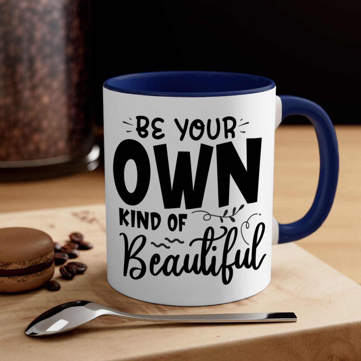 A stylish two-tone ceramic coffee mug with a glossy finish, featuring the phrase 'Be Your Own Kind of Beautiful' and a comfortable C-shaped handle.